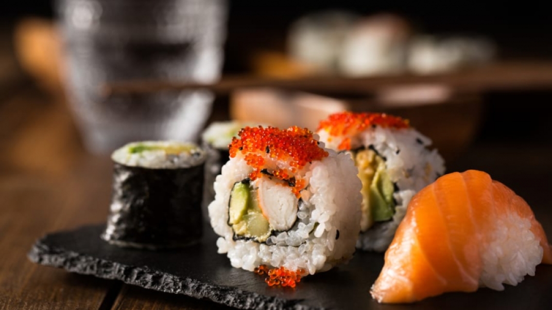 different sushi rolls on a tray