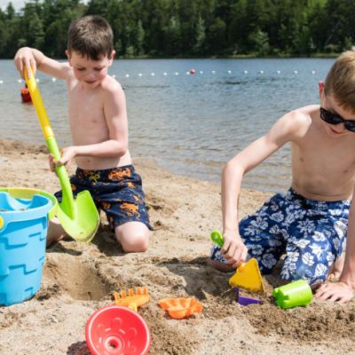 Two boys playing in the sand